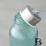 نمای بسته بندی بطری آب شیشه ای انگلیش هوم مدل Looney گنجایش 0.5 لیتر برچسب و بسته بندی
