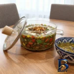 نمای جزئیات قابلمه پیرکس طرح میوه با دستگیره چوبی پرداخت و جزئیات مواد