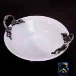 نمای کناری میوه خوری چینی مدل ۵۱۷ با دسته پوتر، قطر ۳۱cm، ارتفاع ظرف ۹cm، ارتفاع پایه ۳cm و قابلیت شست وشو در ماشین ظرفشویی ا