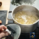 نمای جلو سرویس قابلمه استیل ۷ پارچه وول مدل ST-SET۰۰۲ اصل برچسب کیسه و وزن
