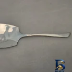 نمای جزئیات سرویس استیل کفگیر و ملاقه ۲ پارچه جی فی نی مدل 063 نمای نزدیک دانه