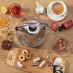 نمای بسته بندی کتری برقی نیولند مدل NL-۳۰۷۶SS گنجایش ۱.۷ لیتر اصل برچسب و بسته بندی
