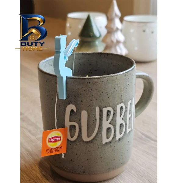پایه نگه دارنده دمنوش و چای کیسه ای مدل پسر ماهیگیر مجموعه دو عددی