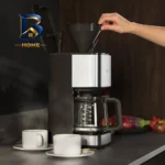 قهوه ساز آ ا گ مدل CM۵-۱-۶ST، ظرفیت دم آوری ده فنجان فاقد فیلتر، دارای تایمر، صفحه گرم نگهدارنده قهوه، تنظیم میزان بخاردهی و مکانیزم نظافت خودکار اصل